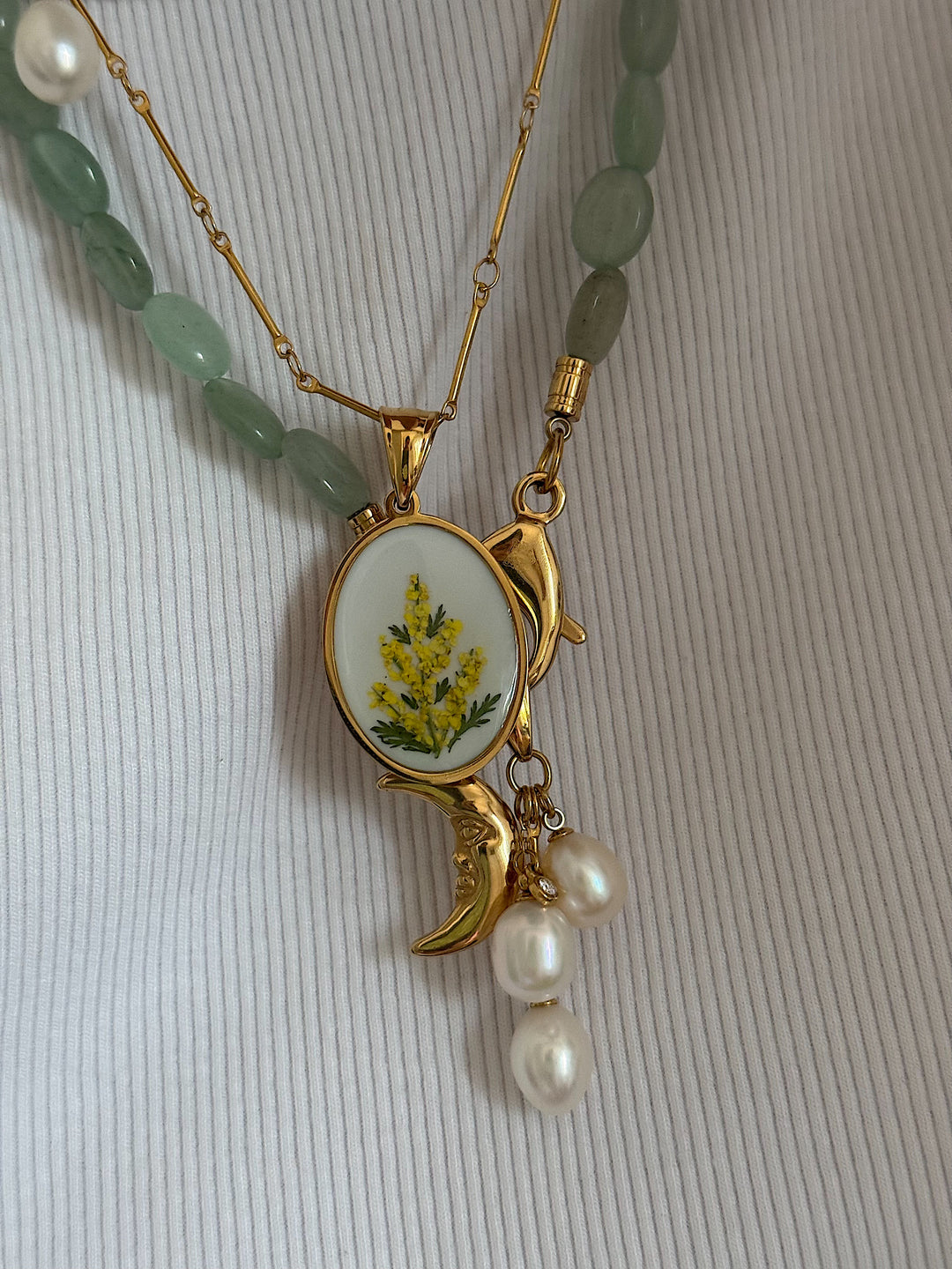 NUDE pendant.